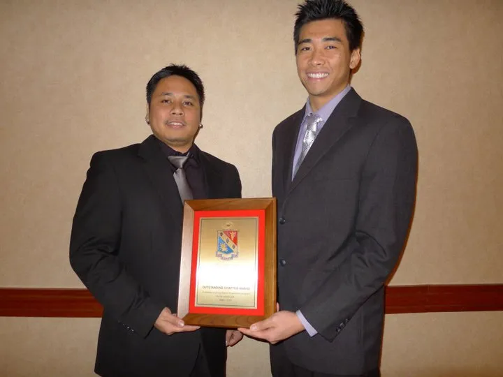 Christopher Manloyolo and Bao Jun Lei with the Outstanding Chapter Award